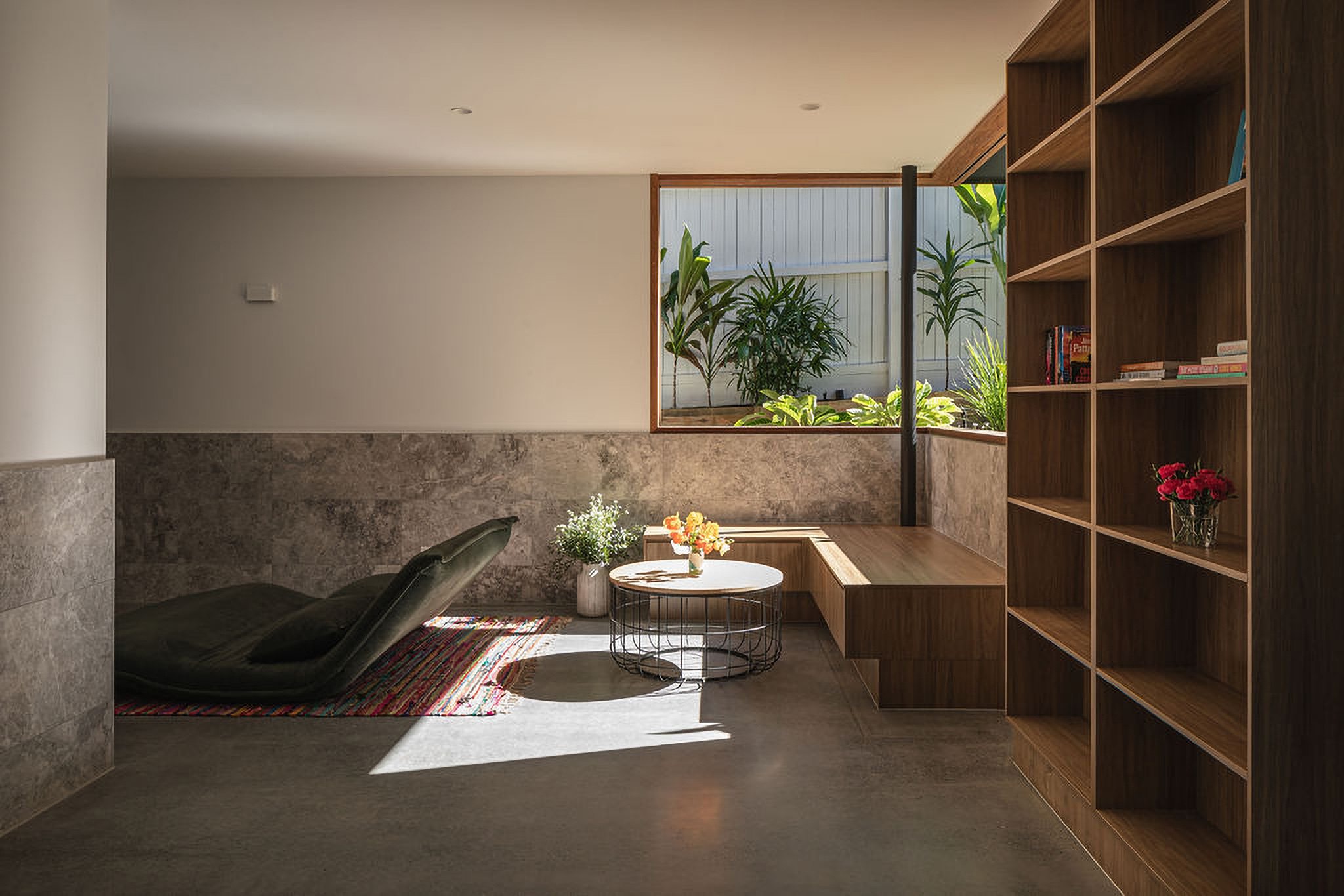 The sunken lounge and library wall