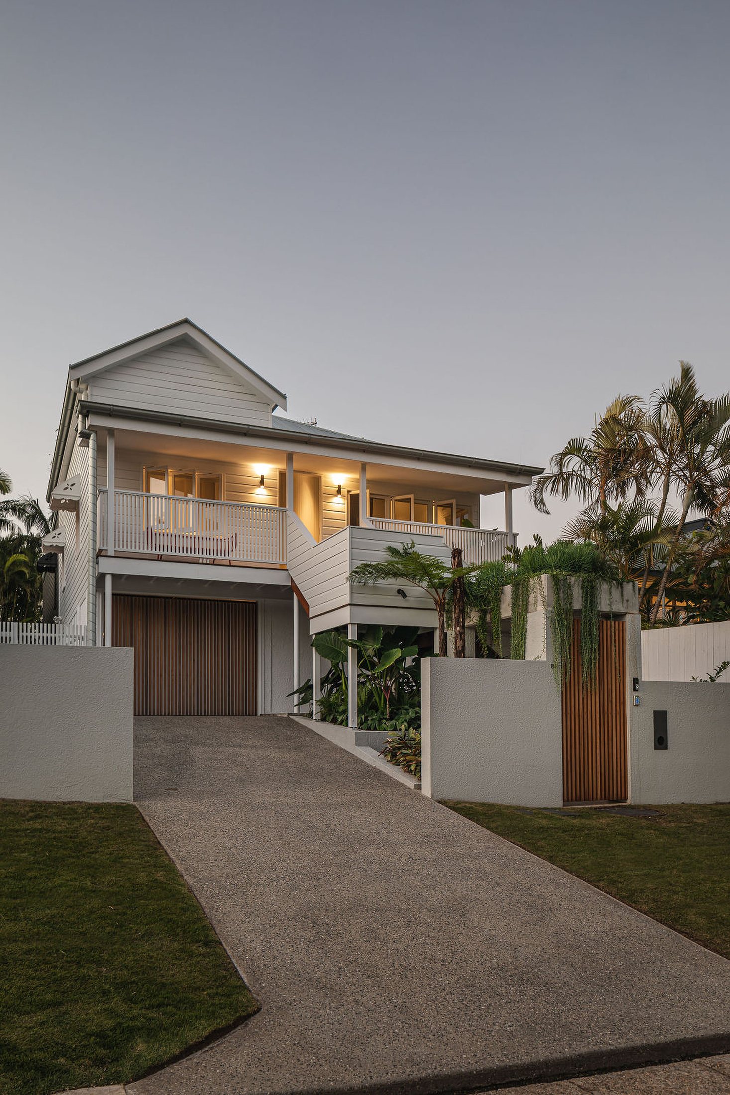 The original house from the street, at dusk